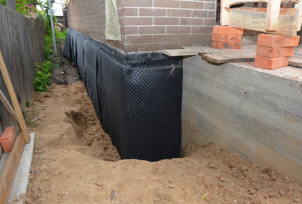 Happy homeowners after waterproofing job in Longport